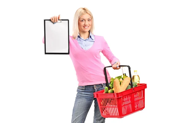 Female holding shopping basket — Stock Photo, Image