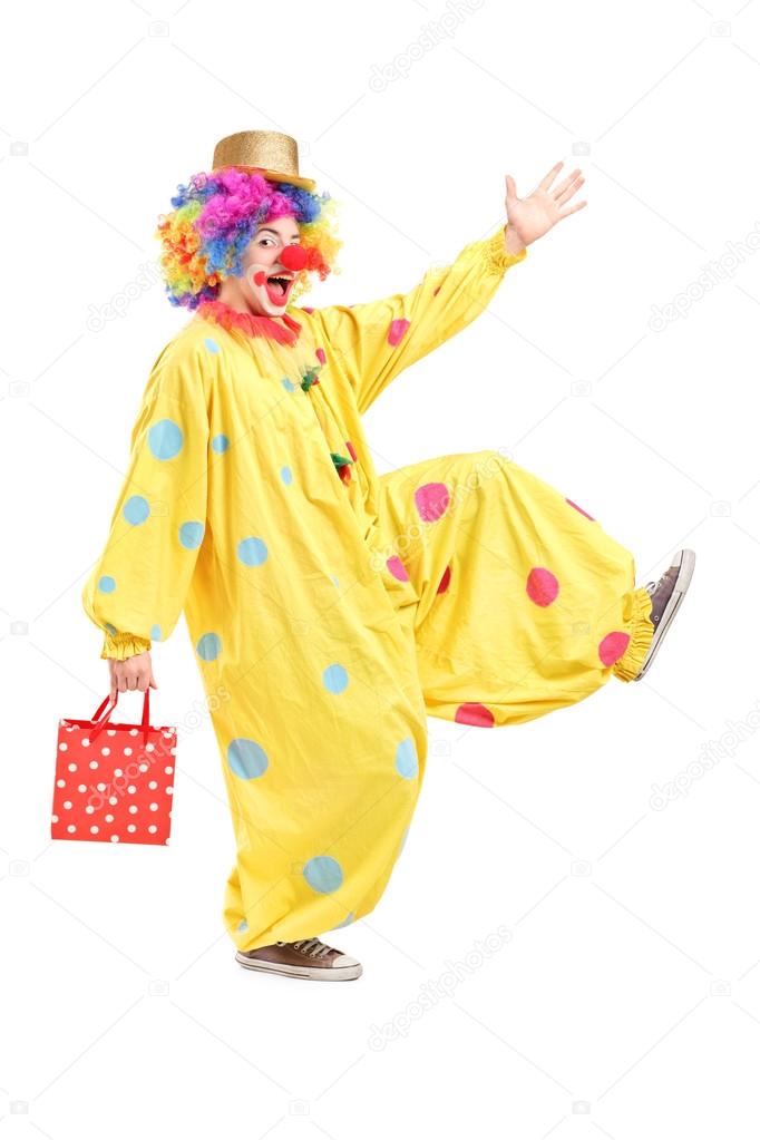 Clown holding bag and walking