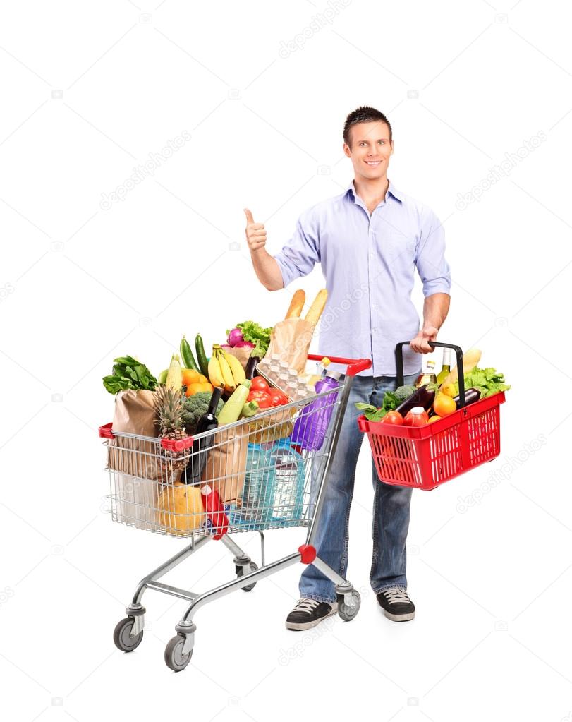 Man holding shopping basket and cart