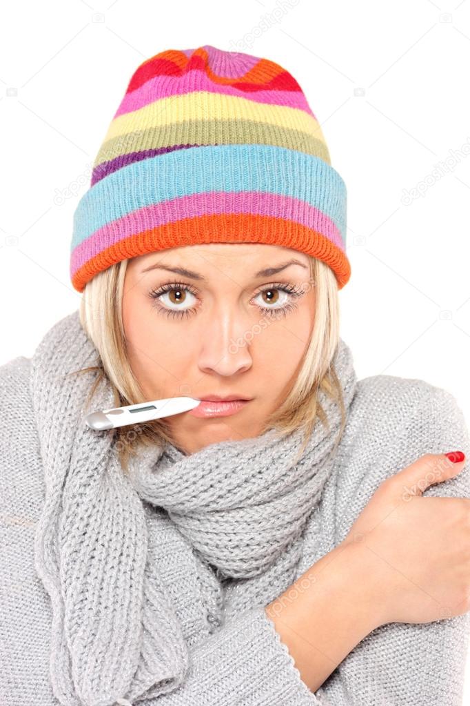 Ill woman with thermometer