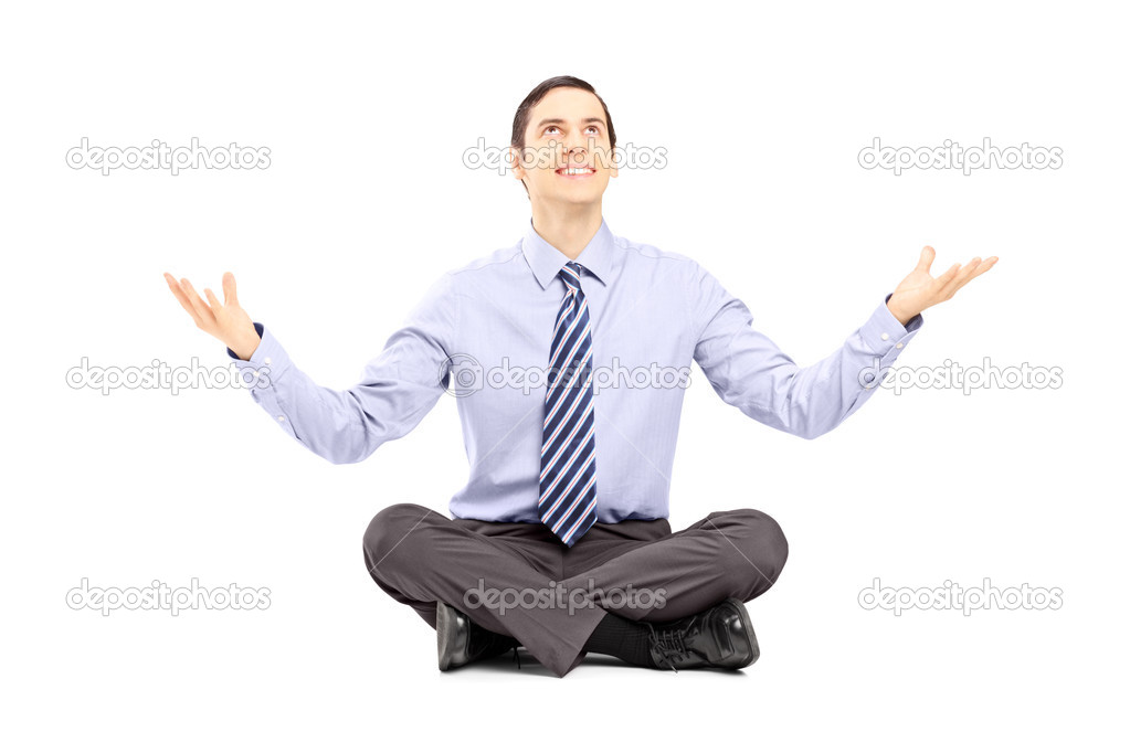 Young businessman sitting on a floor