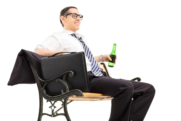 Businessman chilling out with beer — Stock Photo, Image