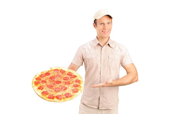 Delivery guy holding a pizza — Stock Photo, Image