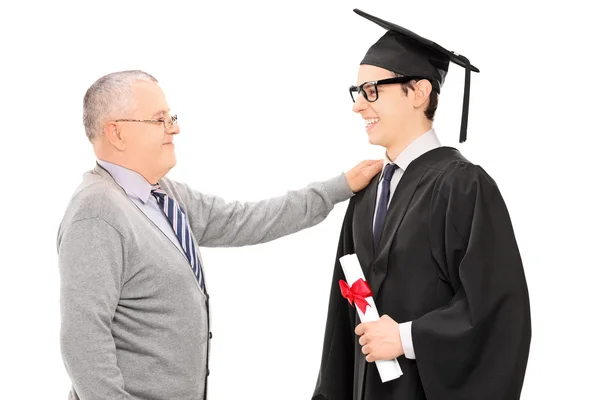 Vader feliciteert zijn zoon — Stockfoto