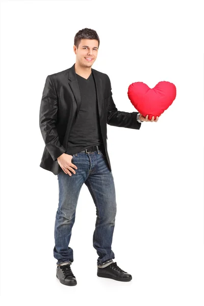 Young man holding red heart — Stock Photo, Image