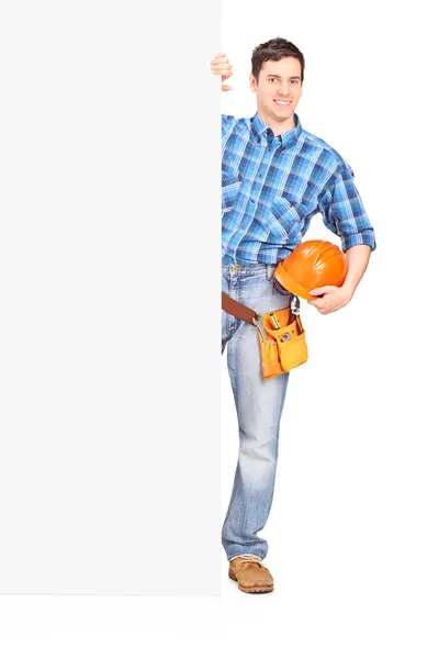 Construction worker standing behind panel — Stock Photo, Image