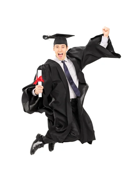 Male graduate student jumping — Stock Photo, Image