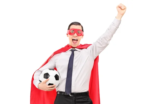 Superhero holding a football — Stock Photo, Image