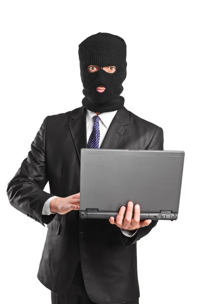 Maskierter Geschäftsmann mit Laptop — Stockfoto