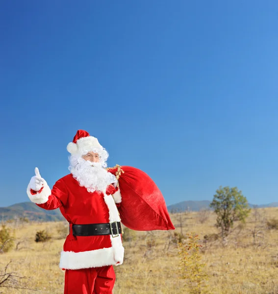 Santa gospodarstwa worek prezentów — Zdjęcie stockowe