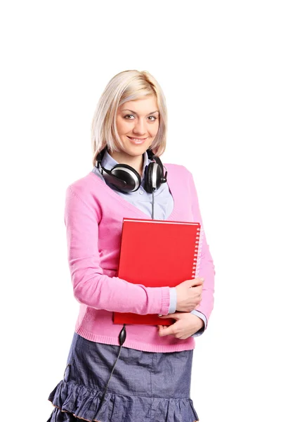 Mulher com fones de ouvido segurando notebook — Fotografia de Stock