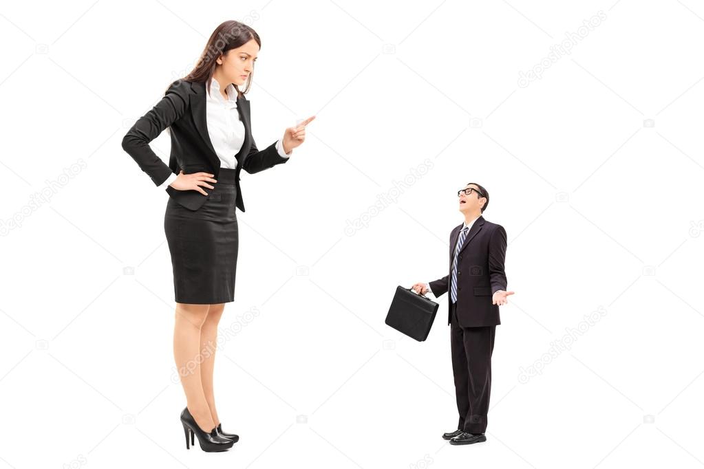 Giant woman threatening tiny businessman