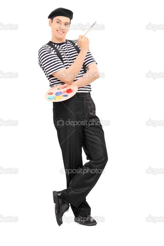 Happy male painter holding paintbrush