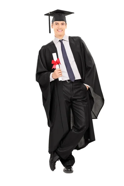 Male graduate holding a diploma — Stock Photo, Image