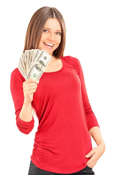 Jovem mulher segurando dinheiro — Fotografia de Stock