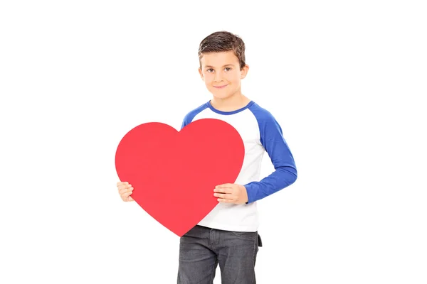 Menino segurando grande coração vermelho — Fotografia de Stock