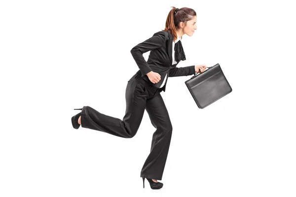 Businesswoman running with briefcase — Stock Photo, Image