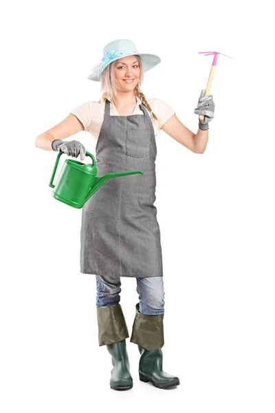 Female gardener holding mattock — Stock Photo, Image