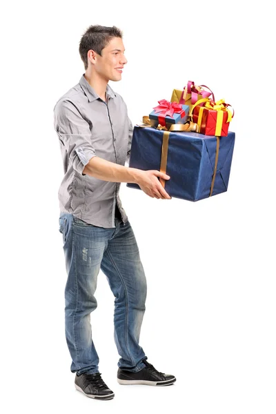 Hombre sosteniendo montón de regalos — Foto de Stock