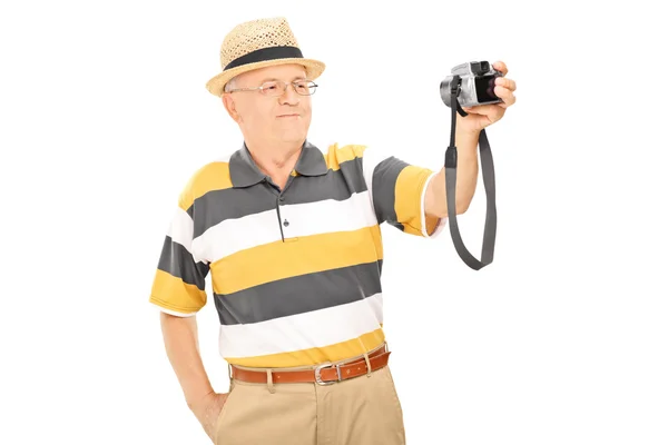 Man taking picture with camera — Stock Photo, Image