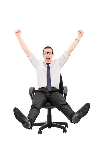 Man riding in office chair — Stock Photo, Image