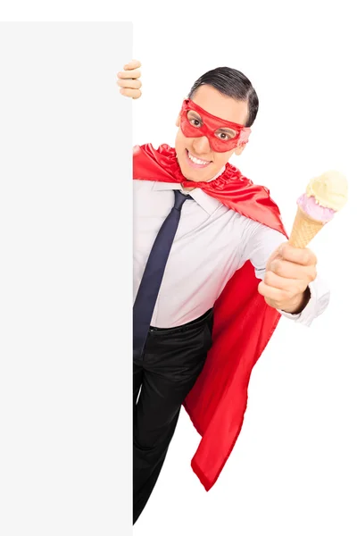 Superhero holding ice cream — Stock Photo, Image