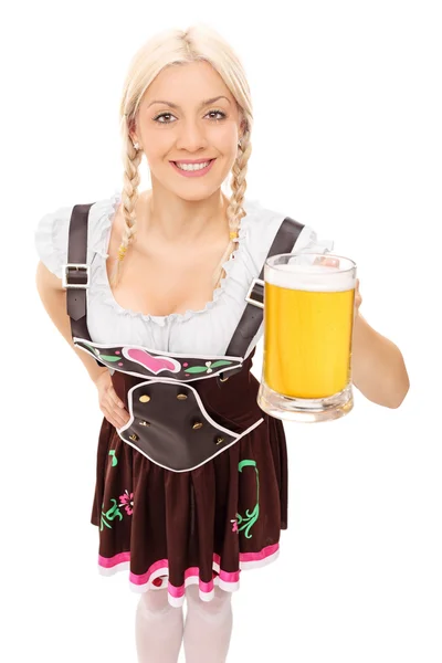 Woman holding pint of beer — Stock Photo, Image