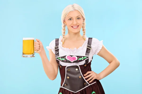 Girl holding pint of beer — Stock Photo, Image