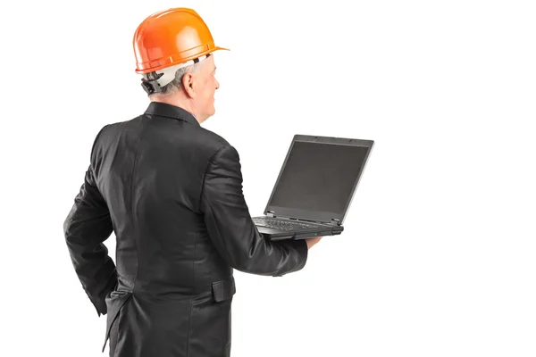 Mature architect worker holding laptop — Stock Photo, Image