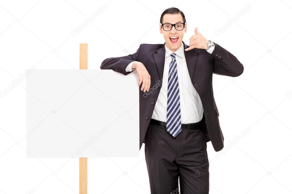 Businessman standing by blank banner