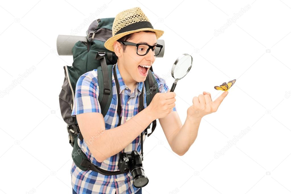 Hiker looking at butterfly