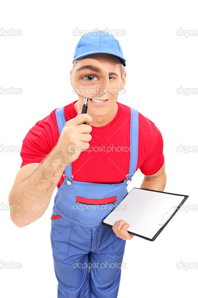 Mechanic looking through magnifying glass