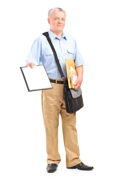 Mailman holding clipboard and envelopes — Stock Photo, Image