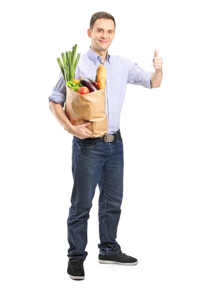 Man holding bag of groceries — Stock Photo, Image