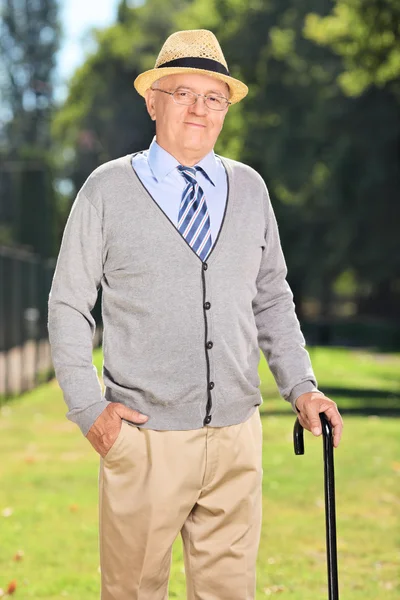 Gentleman with cane in park — Stock Photo, Image