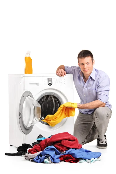 Young man doing laundry — Stock Photo, Image