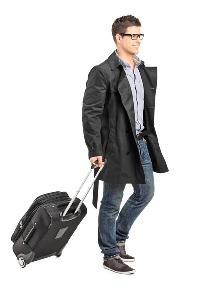 Jonge man die zijn bagage — Stockfoto