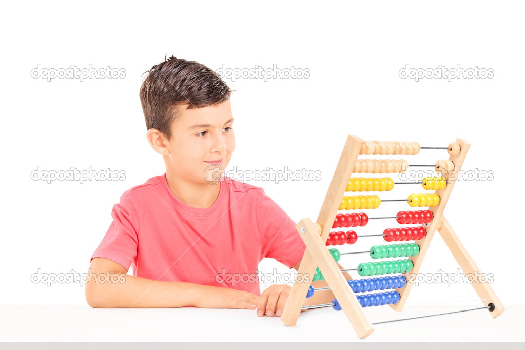 Little boy counting on abacus