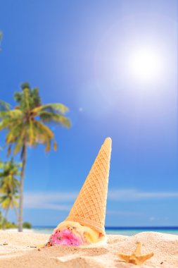 Ice cream melting in sand clipart