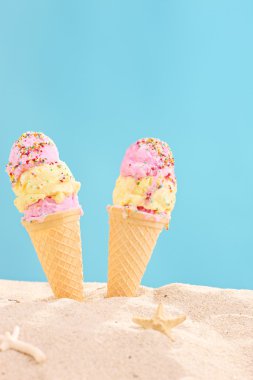 Ice creams stuck in sand clipart