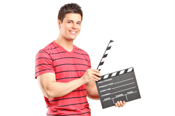 Casual man holding movie clap — Stock Photo, Image