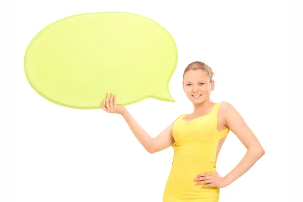 Elegant woman holding speech bubble — Stock Photo, Image