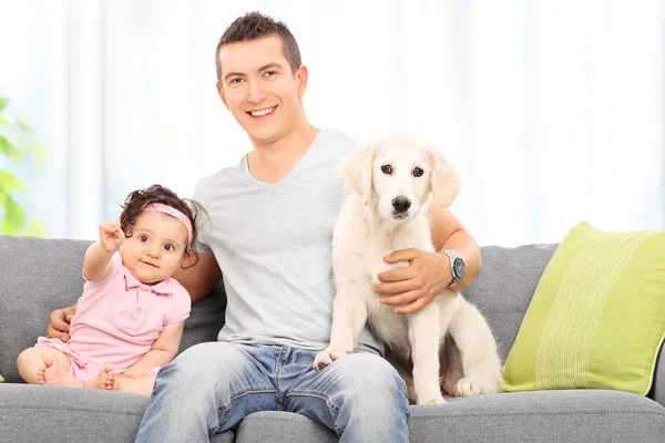 Father with daughter and puppy — Stock Photo, Image