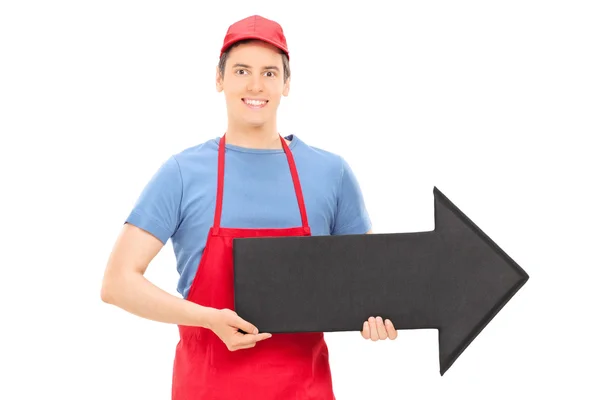 Hombre sosteniendo flecha apuntando a la derecha — Foto de Stock