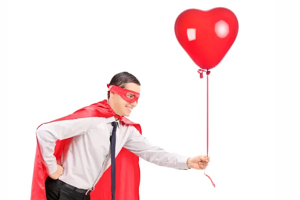 Homem de traje segurando balão — Fotografia de Stock