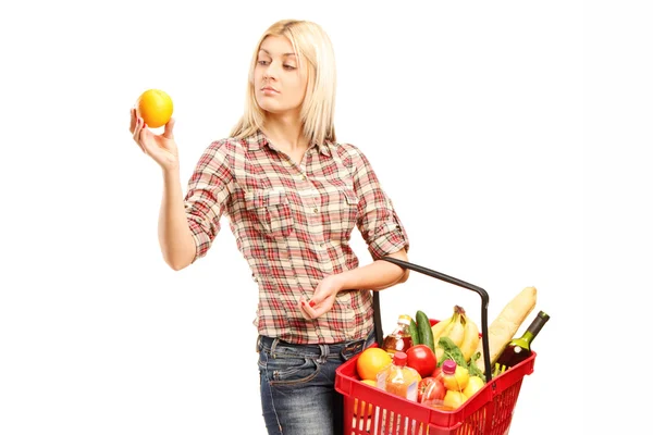 Woman holding basket — Stock Photo, Image