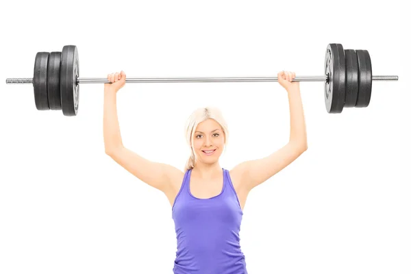 Female athlete lifting heavy barbell Royalty Free Stock Images