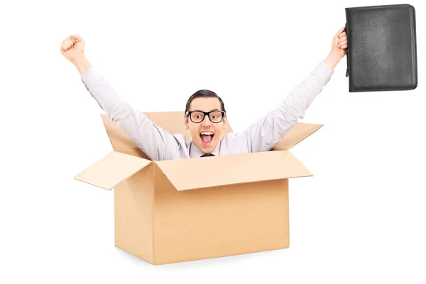 Businessman gesturing happiness inside box — Stock Photo, Image