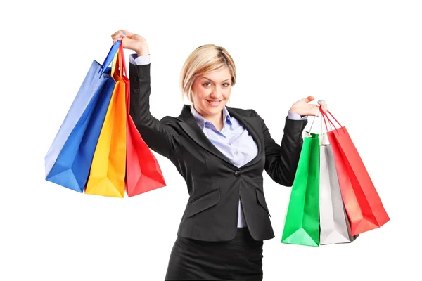 Businesswoman holding shopping bags — Stock Photo, Image