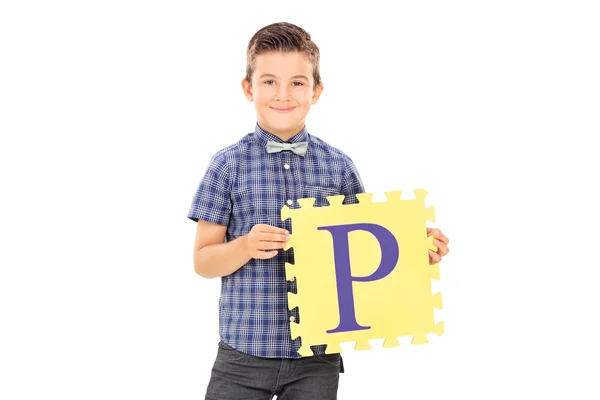 Kid segurando peça de quebra-cabeça — Fotografia de Stock